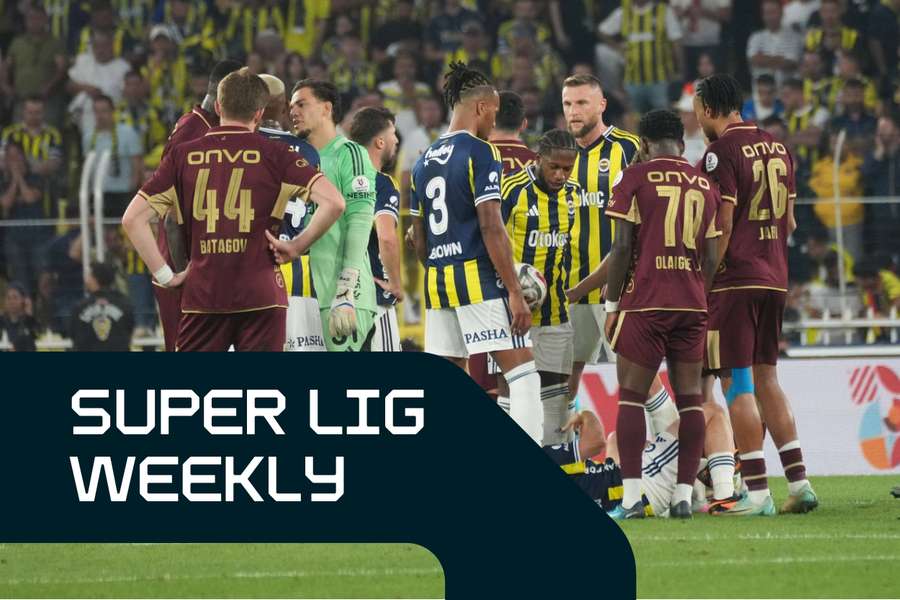 Fenerbahce and Trabzonspor players react after a tackle on Kerem Akturkoglu