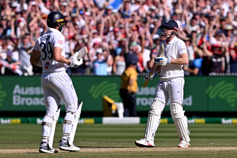 England's Jamie Smith (left) and Harry Brook celebrate after seeing England to a four-wicket victory