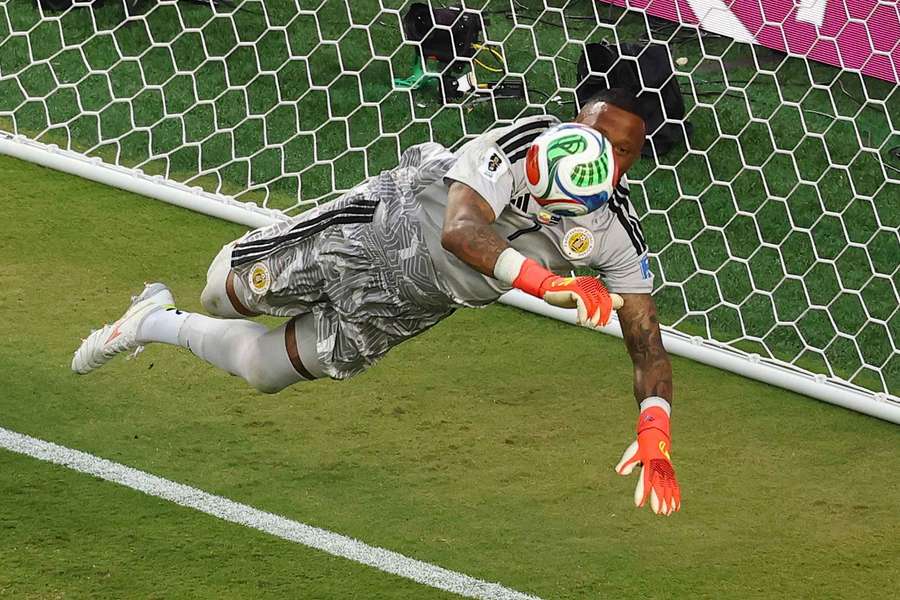 Eloy Room fends off an Ecuador shot in a historic game for Curacao