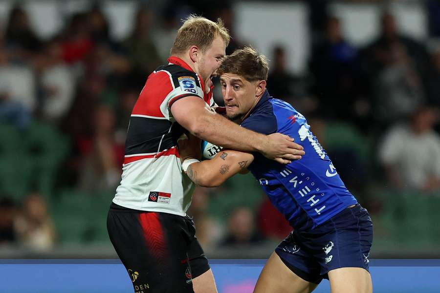 Western Force's Zac Lomax attempts to fend off a tackle at the weekend.