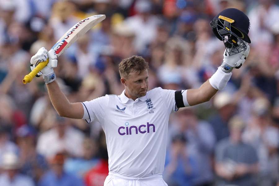 Root celebrates his century