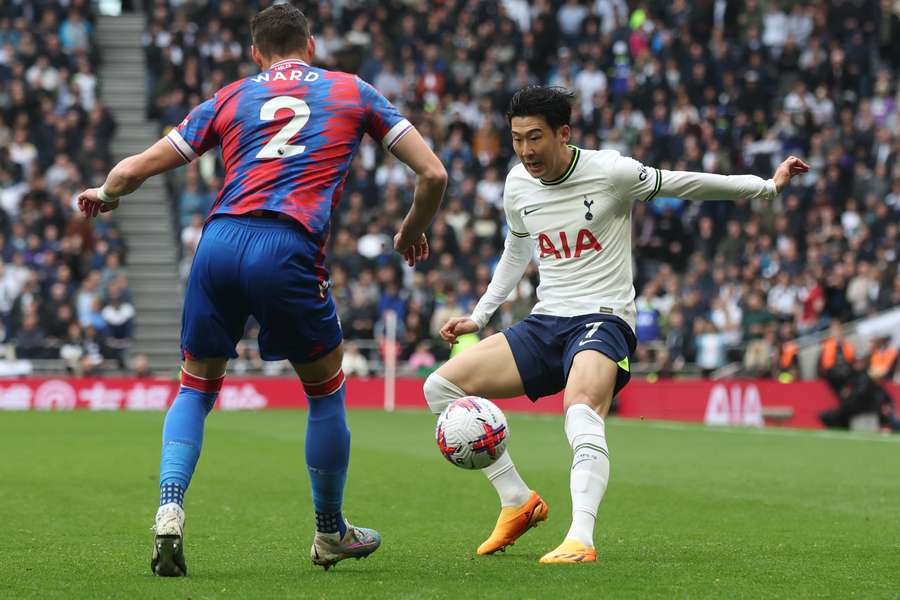 Crystal Palace's English defender Joel Ward (L) fights for the ball with Tottenham Hotspur's South Korean striker Son Heung-Min