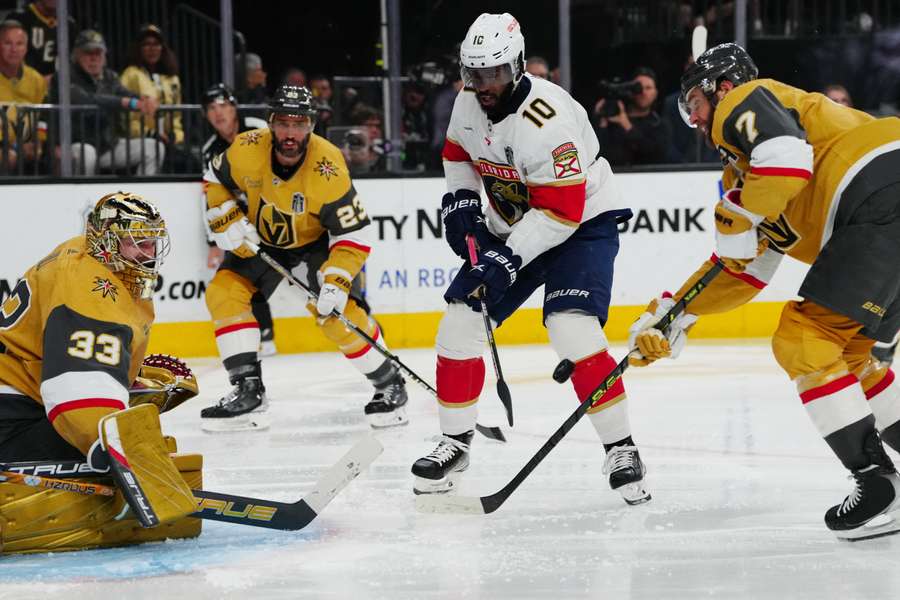 Florida Panthers left wing Anthony Duclair battles Vegas Golden Knight players in Game Two