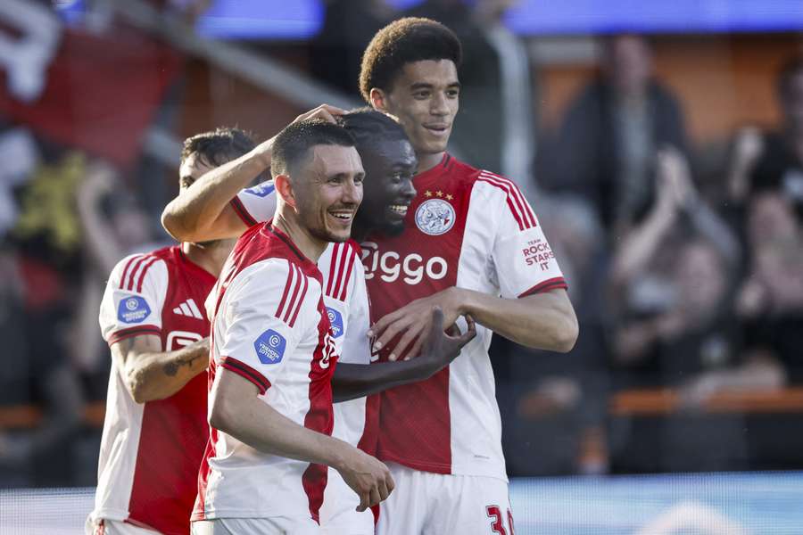 Ajax celebrate Jorthy Mokio's (centre) 2-0 against FC Groningen Ajax celebrate Jorthy Mokio's (centre) 2-0 against FC Groningen