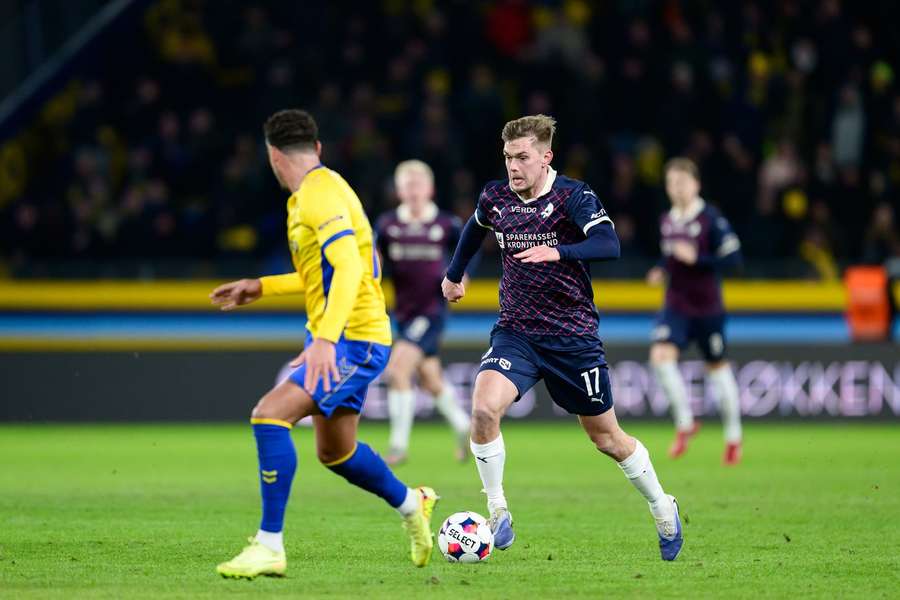 Mathias Greve drive the ball forward at Brondby stadium