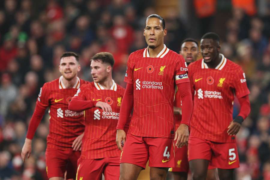 Virgil van Dijk of Liverpool looks on with teammates during the Premier League match against Aston Villa