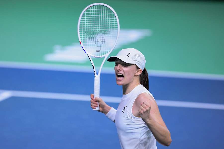 Swiatek celebrates her win over Badosa at the BJK Cup