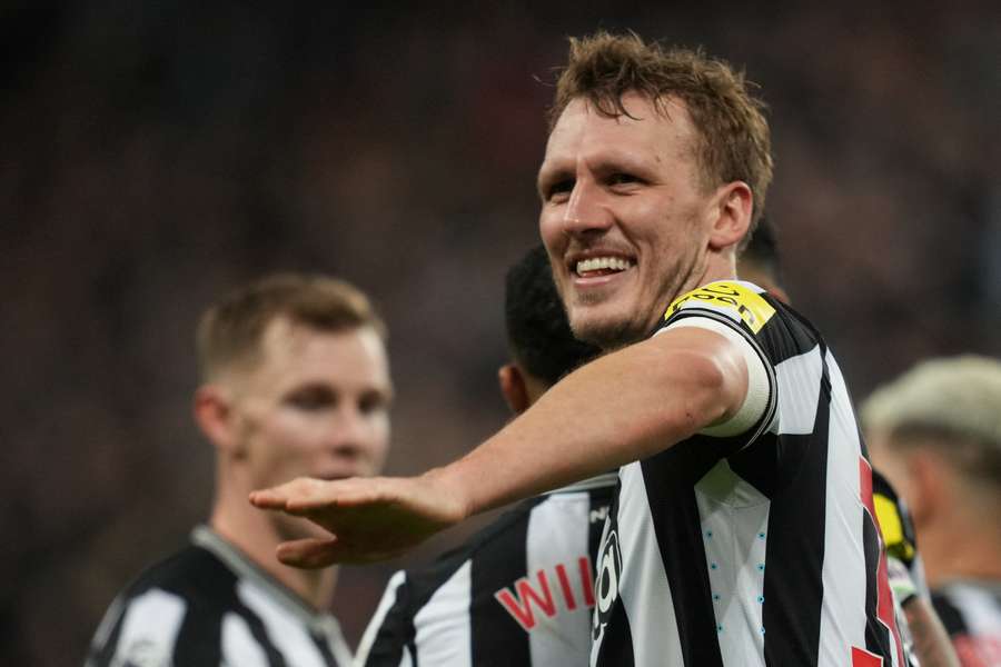 Newcastle United's English defender #33 Dan Burn celebrates after scoring their third goal