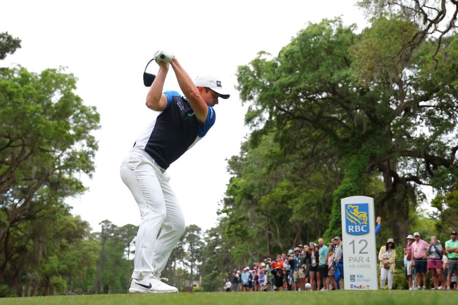 Viktor Hovland of Norway plays his shot from the 12th