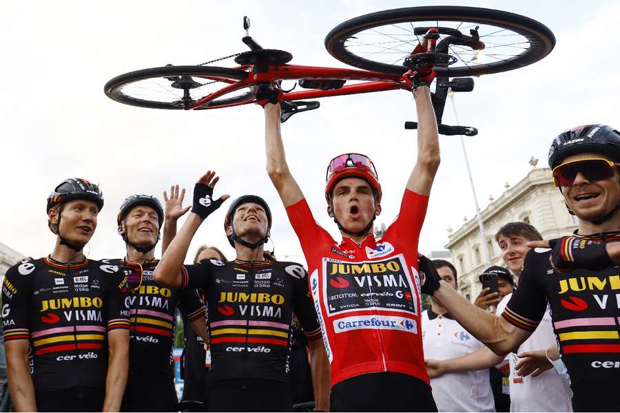 Team Jumbo–Visma's Sepp Kuss celebrates with teammates after winning Vuelta a Espana