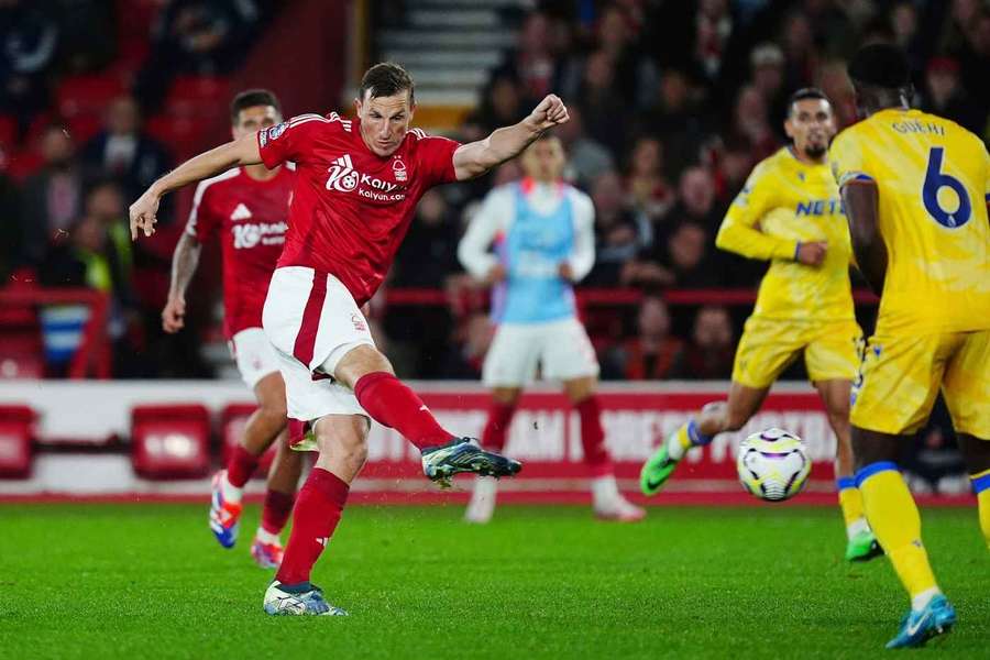 Chris Wood scores his side's goal during the match between Crystal Palace in Nottingham