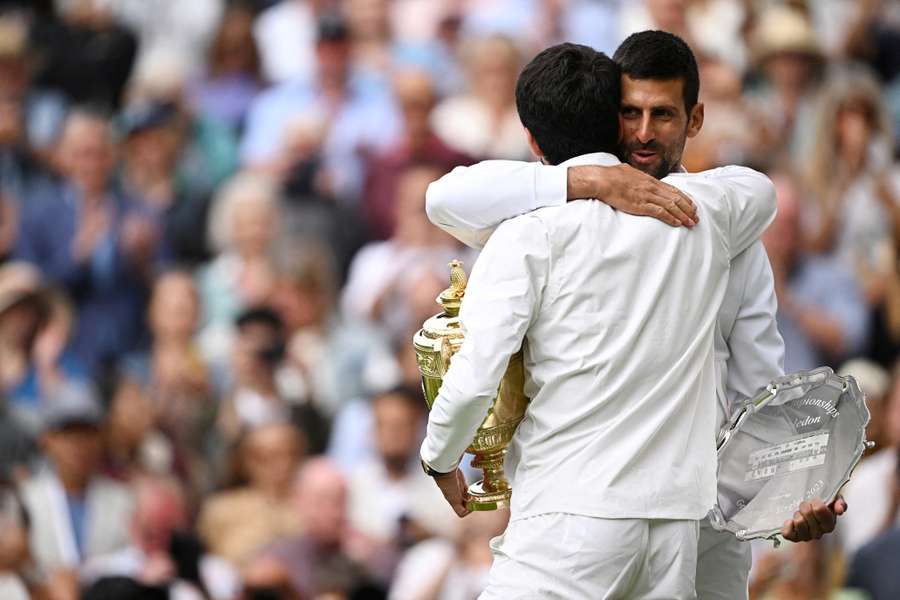 Alcaraz and Djokovic embrace