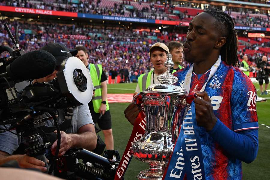 Eze celebrates with the FA Cup trophy