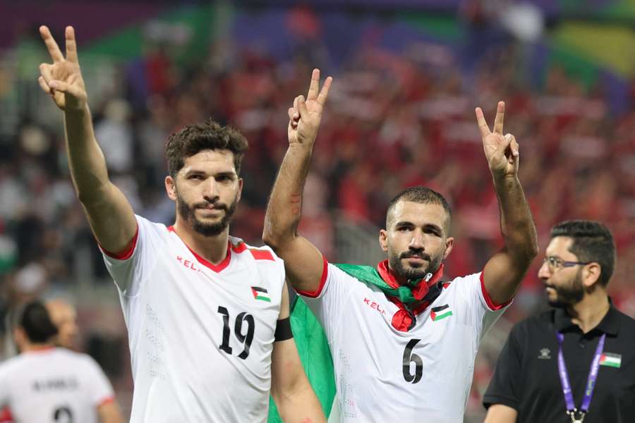 Palestine celebrate after beating Hong Kong