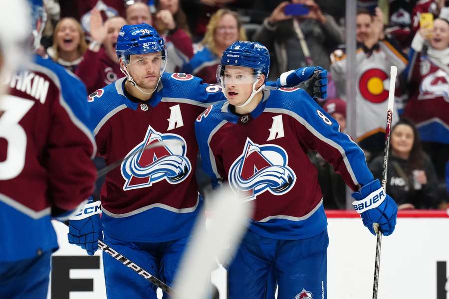 Colorado Avalanche defenseman Cale Makar celebrates his goal with right wing Mikko Rantanen in the second period against the Calgary Flames 