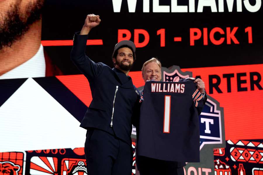 Quarterback Caleb Williams poses with NFL Commissioner Roger Goodell after being selected first overall by the Chicago Bears