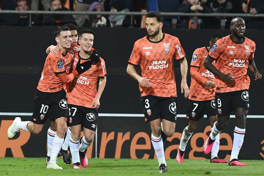 Lorient celebrate one of their two gaols against Rennes