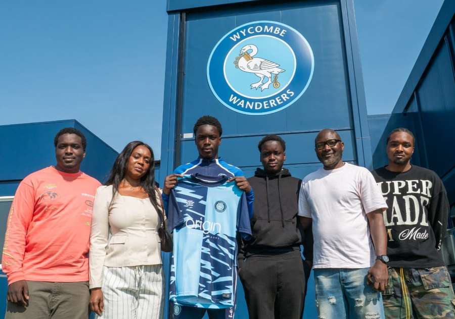 Micah Olabiyi alongside his family Micah Olabiyi alongside his family