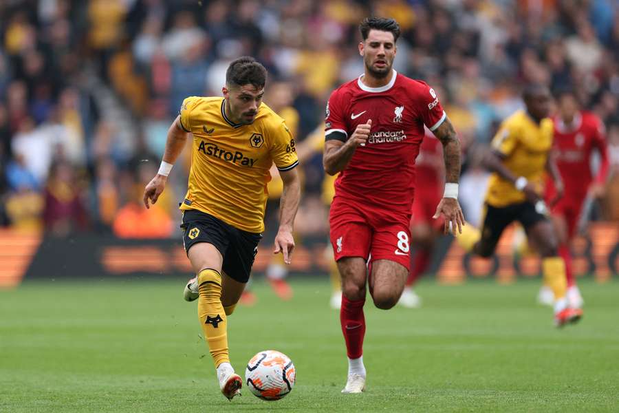 Wolves' Pedro Neto runs away from Liverpool's Dominik Szoboszlai