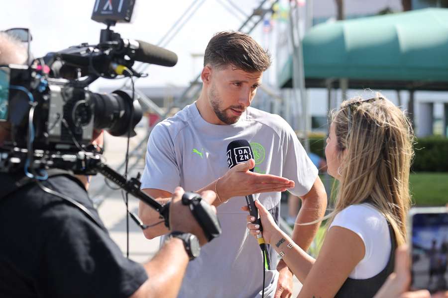 Ruben Dias speaks to DAZN after arriving in the USA with his Man City teammates on Thursday