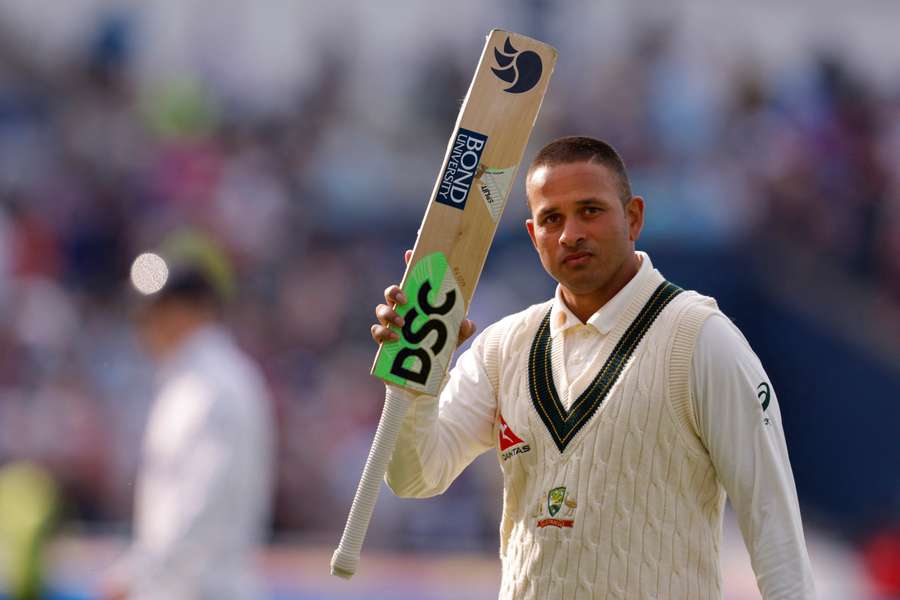 Khawaja acknowledges the crowd as he walks off the field at stumps after scoring 126 runs not out