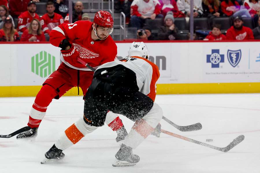 Red Wings defenseman Shayne Gostisbehere skates with the puck