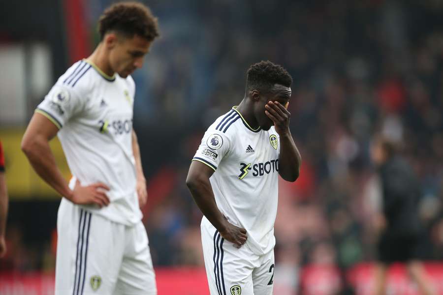 Leeds United's Brazilian-born Spanish striker Rodrigo (L) and Leeds United's Italian striker Wilfried Gnonto (R) react to their defeat on the pitch