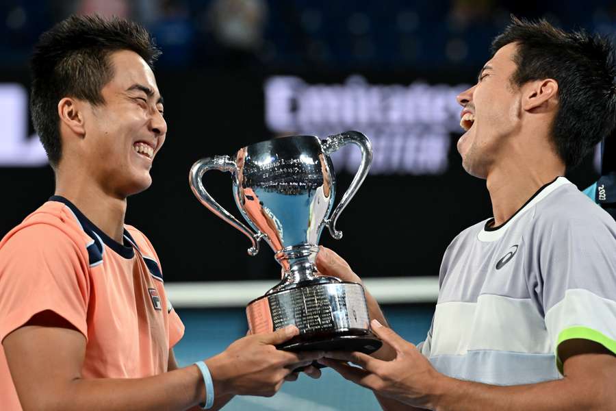 Australia's Rinky Hijikata and Jason Kubler pose with the trophy after victory against Poland's Jan Zielinski and Monaco's Hugo Nys
