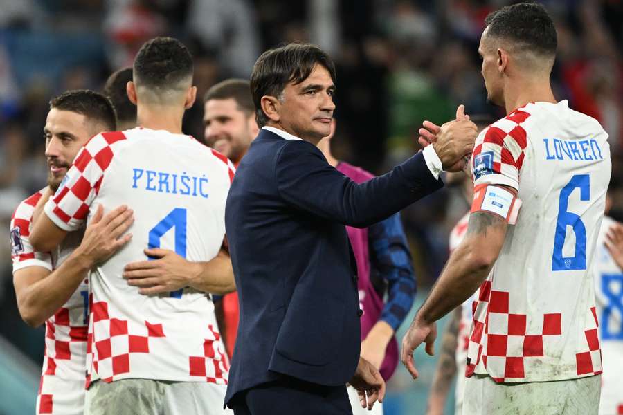 Zlatko Dalic celebrates with his team after they reached the quarter-finals