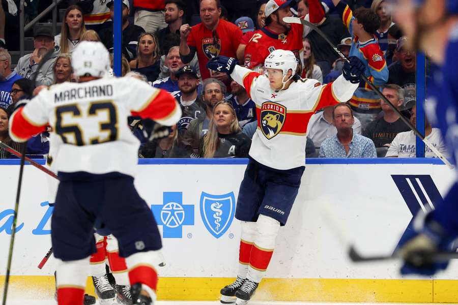 Eetu Luostarinen of the Florida Panthers celebrates after scoring a goal against the Tampa Bay Lightning during the third period in Game Five