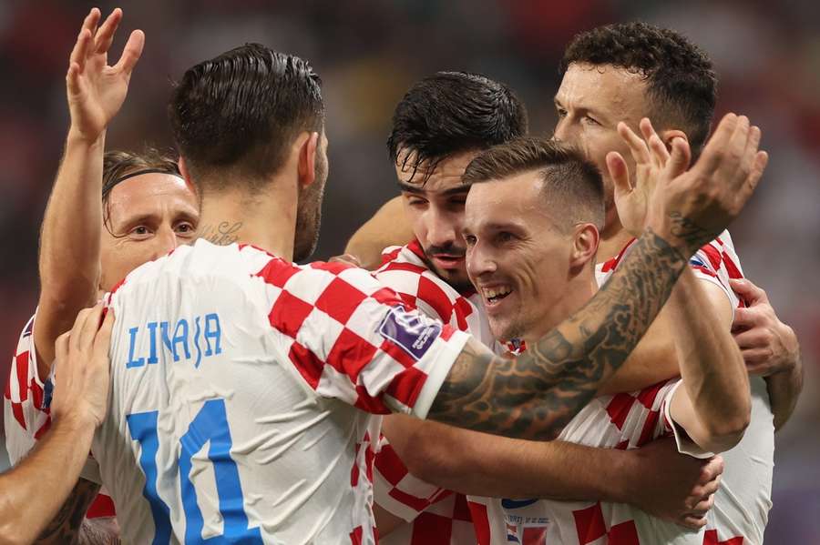 Mislav Oršić celebrates with teammates after giving Croatia a 2-1 lead over Morocco.