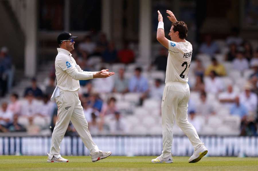 New Zealand's Matt Henry celebrates with Tom Latham after taking the wicket of England's Jordan Cox to win the match New Zealand's Matt Henry celebrates with Tom Latham after taking the wicket of England's Jordan Cox to win the match