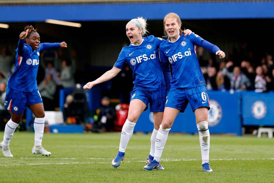 Chelsea's Sjoeke Nusken celebrates scoring their fourth goal with Ellie Carpenter