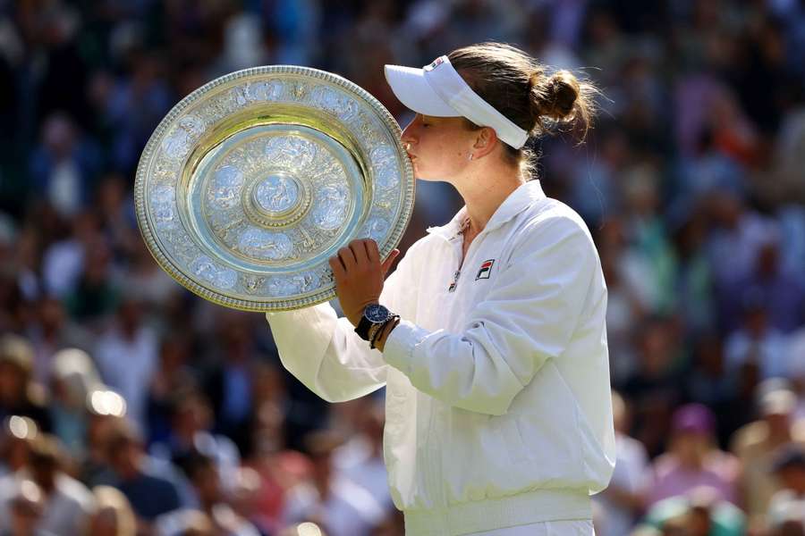 Barbora Krejcikova kisses the Venus Rosewater Dish trophy after winning the final