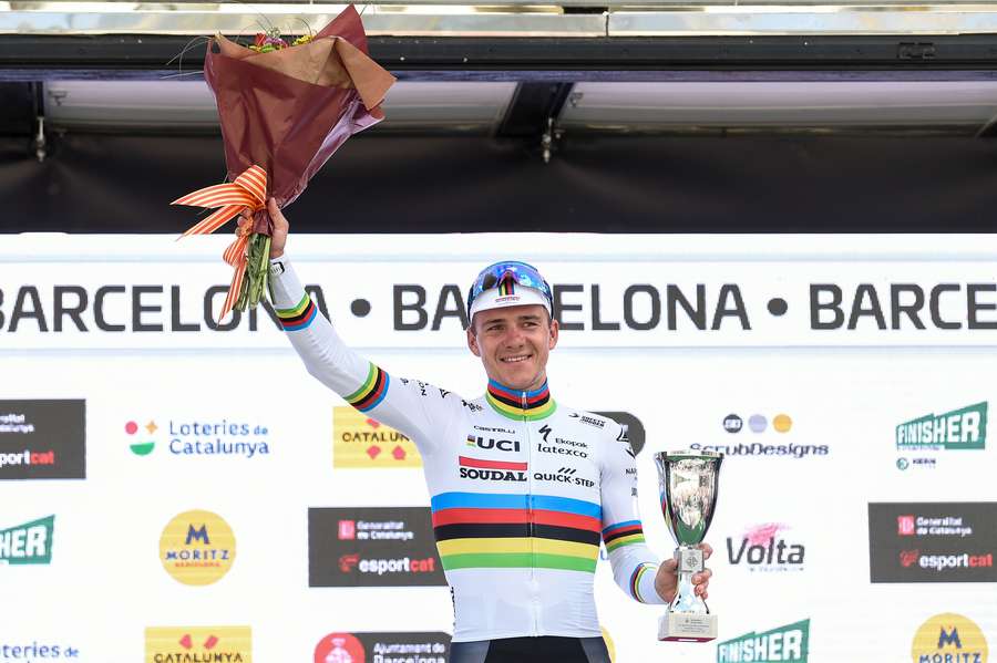 Team Quick Step's Belgian rider Remco Evenepoel celebrates on the podium