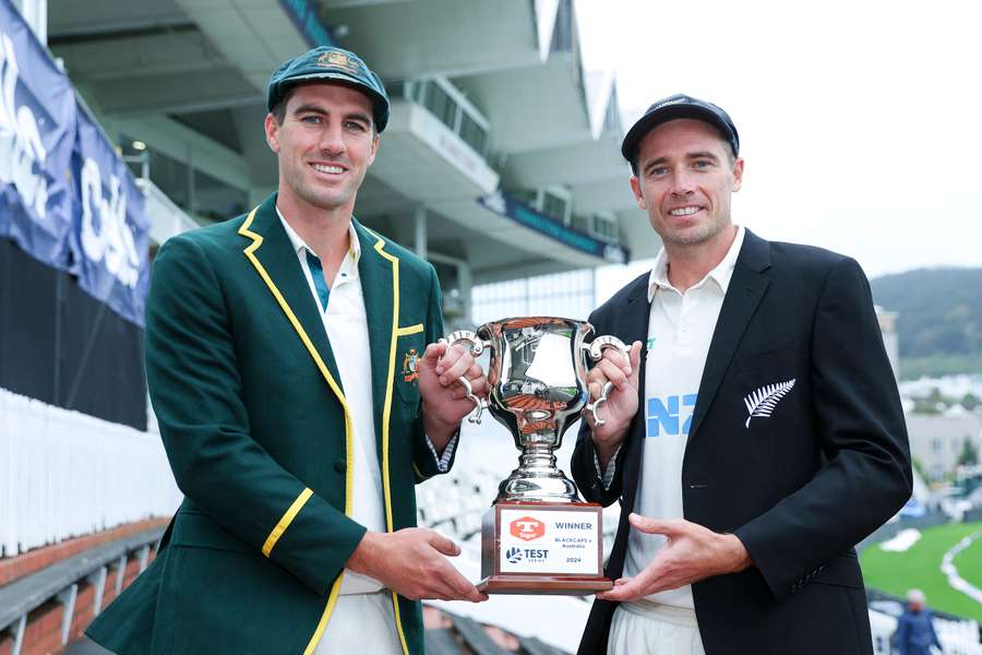 Australian captain Pat Cummins (L) and New Zealand skipper Tim Southee pose with the trophy ahead of the two-Test series