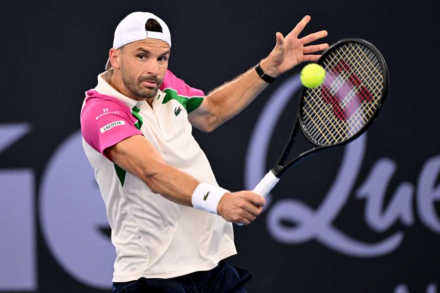 Grigor Dimitrov of Bulgaria hits a return during his match against Aleksandar Vukic in Brisbane