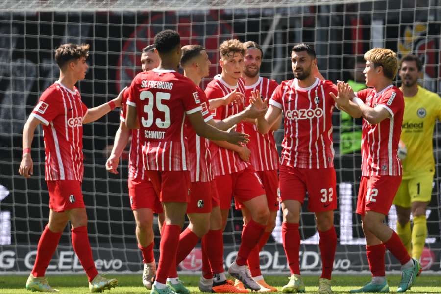 Bundesliga last day roundup: Stuttgart face relegation playoff as Augsburg  beat the drop