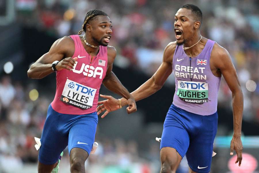 Zharnel Hughes celebrates alongside Noah Lyles at the end of the men's 100m final