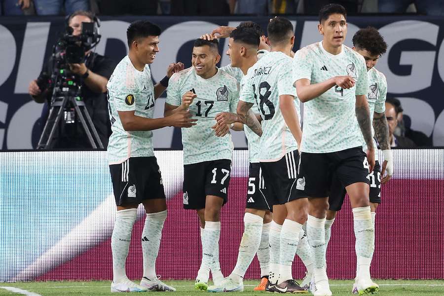 Mexico celebrate scoring a goal against Haiti