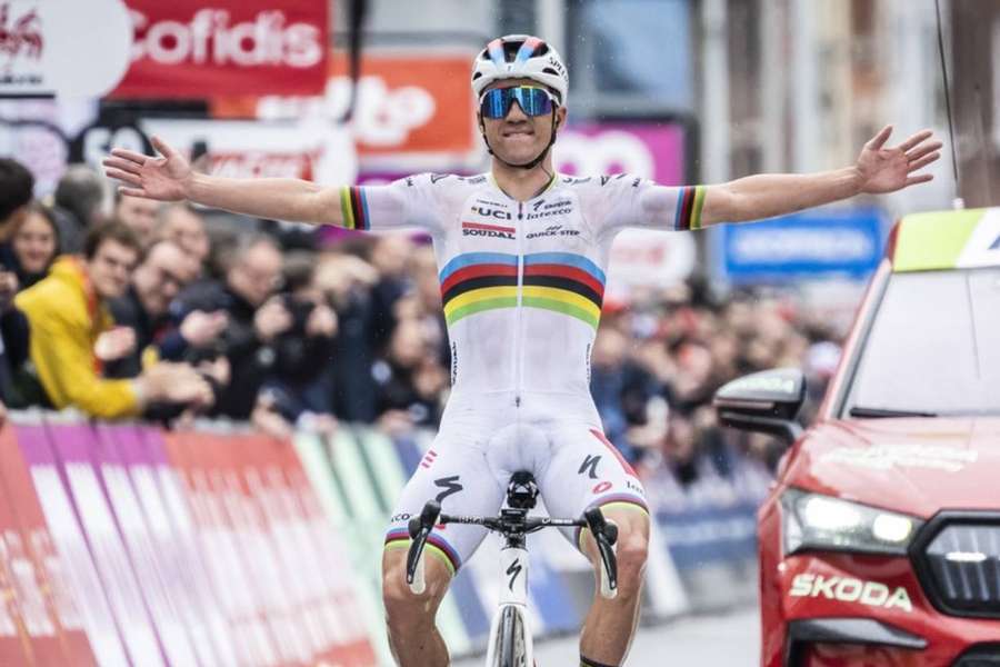 Remco Evenepoel of Soudal Quick-Step celebrates as he crosses the finish line to win the Liege-Bastogne-Liege