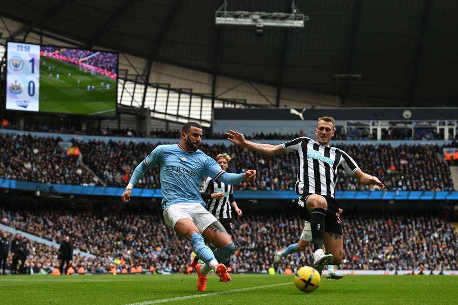 Walker (L) in action against Newcastle United