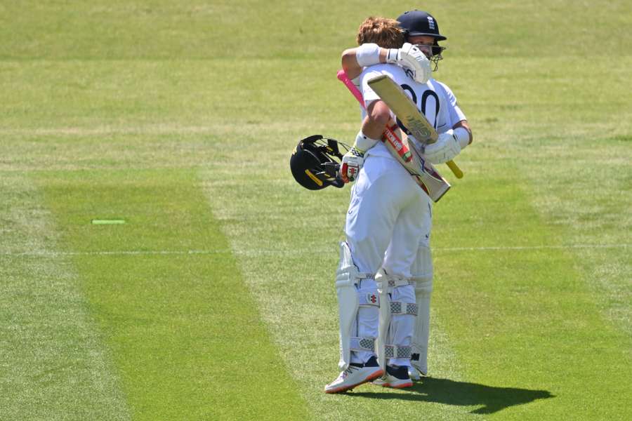 England's Ollie Pope is congratulated by Ben Duckett (R) after reaching his hundred
