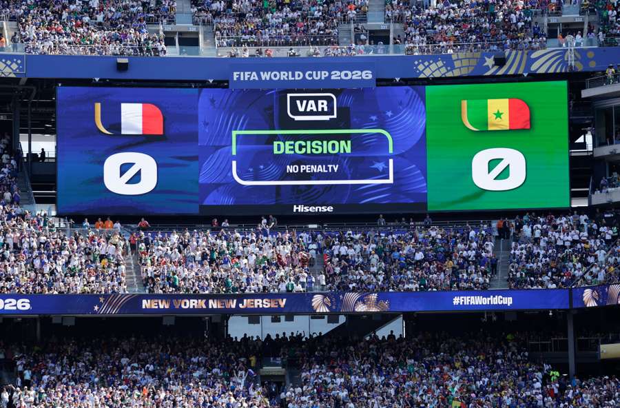 The big screen displays a VAR review message leading to no penalty for France The big screen displays a VAR review message leading to no penalty for France