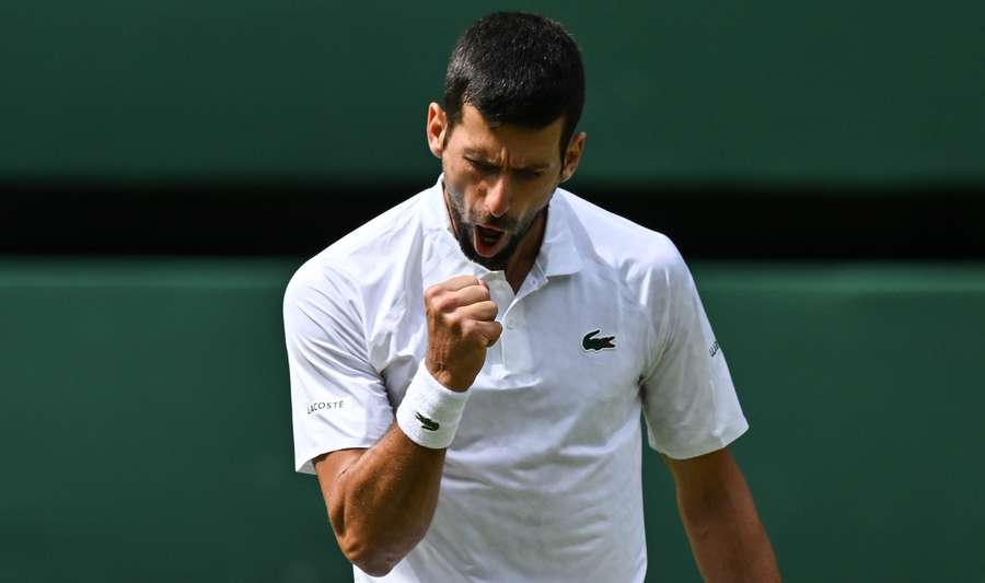 Novak Djokovic reacts as he plays against Carlos Alcaraz