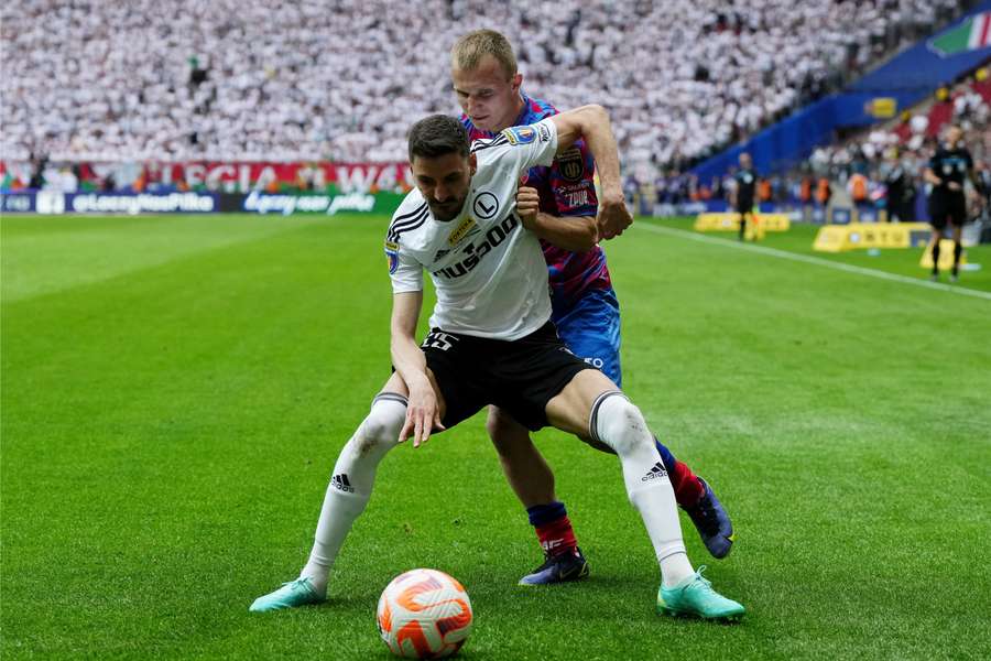 Rakow Czestochowa's Patryk Kun in action with Legia Warsaw's Legia Warsaw's Filip Mladenovic