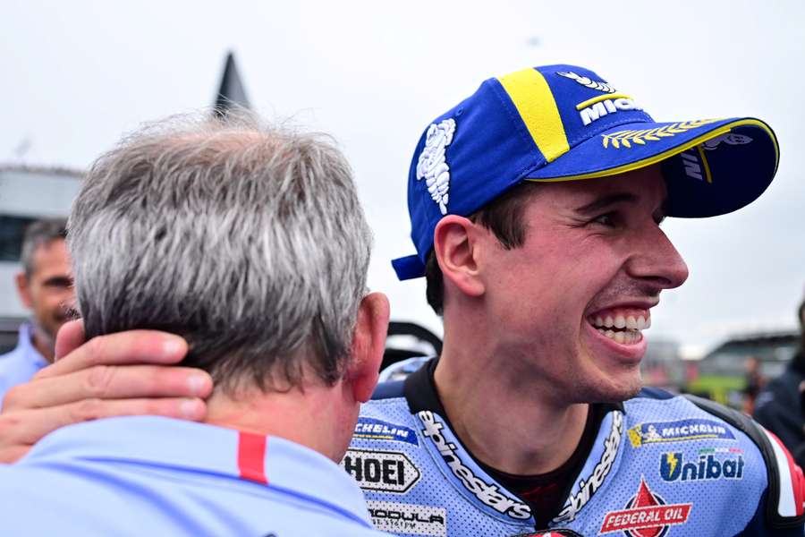 Alex Marquez (R) smiles after his sprint race