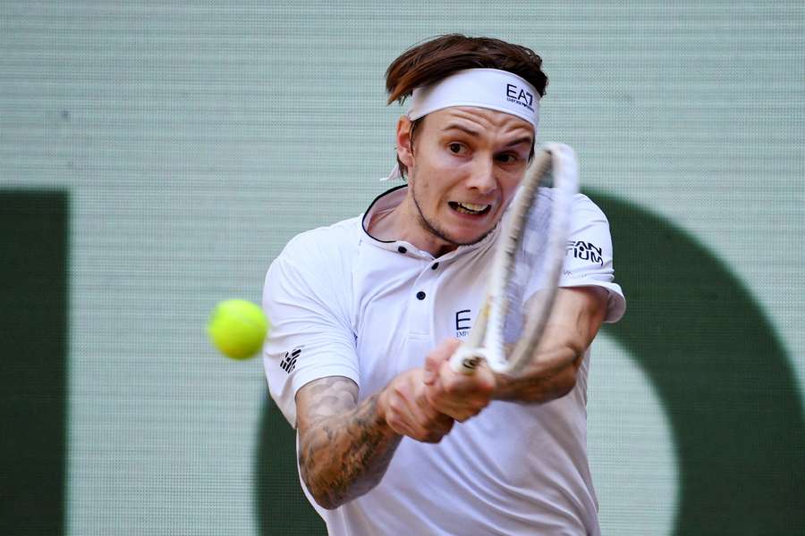 Alexander Bublik in action during the final match against Andrey Rublev