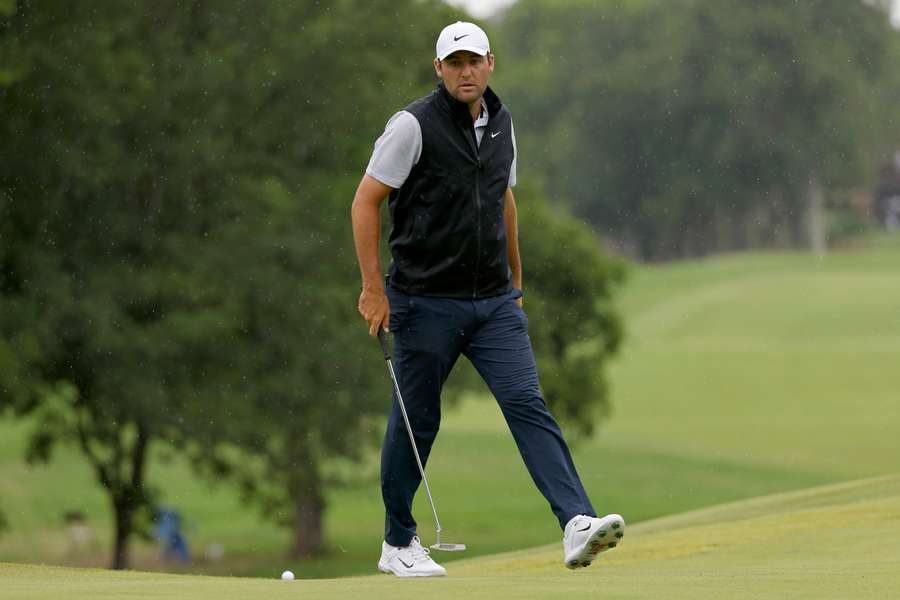 Scottie Scheffler of the United States lines up a putt