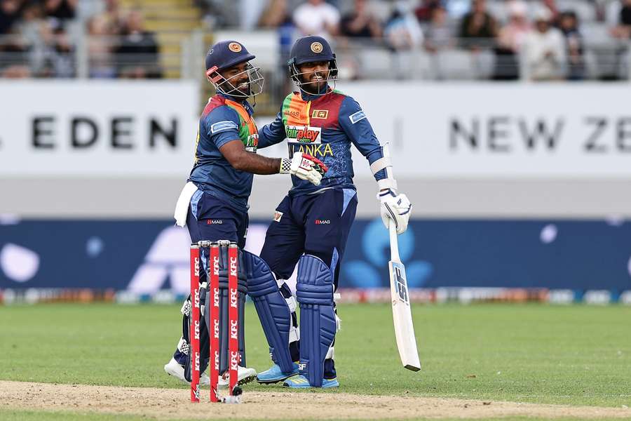 Sri Lanka's Charith Asalanka (L) and Kusal Mendis celebrate winning the Super Over